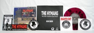 The Hymans - Rocker (7" vinyl, booze002, leather bag edition: transparent purple vinyl with black splatter, 20 copies. + The Hymans sticker, The Hymans iron-on sticker, The Hymans 1" pin, Bootleg Booze Records sticker, Bootleg Booze Records iron-on sticker, Bootleg Booze Records 1” pin, Flyer signed by The Hymans)