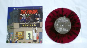 The Hymans - Rocker (7" vinyl, booze002, limited version, transparent purple vinyl with black splatter, 82 copies. 10 of those copies comes with Hymans and Bootleg Booze iron-on stickers)